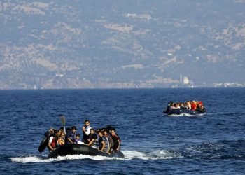 Dinghies overcrowded with Afghan and Syrian refugees