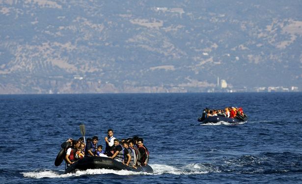 Dinghies overcrowded with Afghan and Syrian refugees