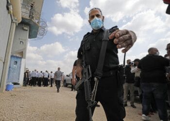 An Israeli officer gestures outside the Gilboa Prison in northern Israel 6 September 2021 AFP