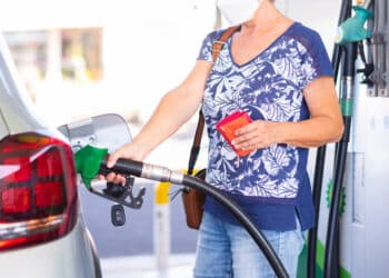 woman holding petrol gasoline fuel pump to refuel 2022 02 16 01 47 14 utc scaled
