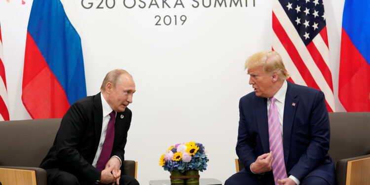 Russia's President Vladimir Putin and U.S. President Donald Trump talk during a bilateral meeting at  the G20 leaders summit in Osaka, Japan, June 28, 2019.  REUTERS/Kevin Lamarque/File Photo